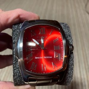Invicta watch  excellent condition with watch box silver with red/orange dial